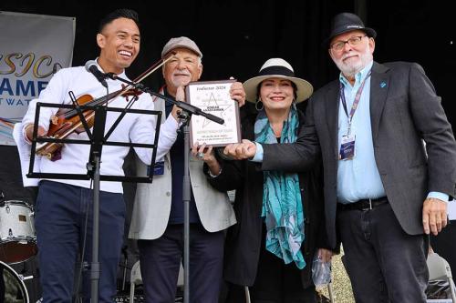 Adrian Anantawan receiving plaque from Cliff, Patti and Don