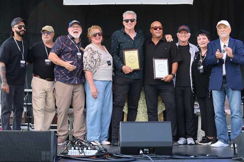 Board with 2026 inductees and Triumph star Rik Emmett